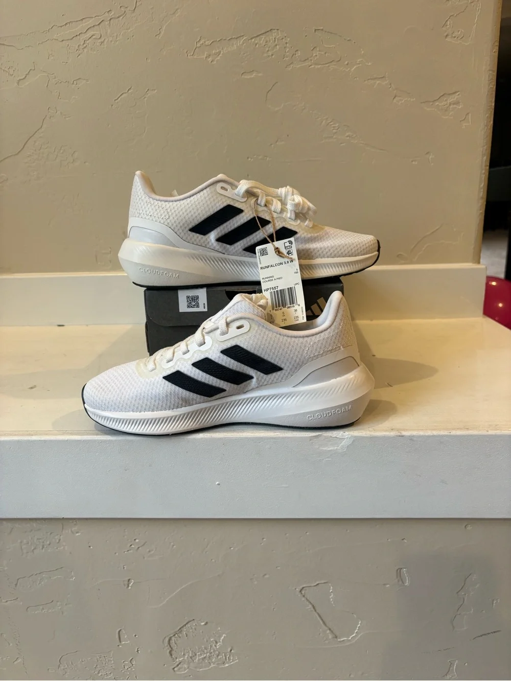 Adidas Women’s White Sneakers with Black Stripes